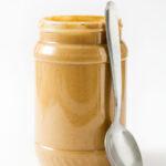 depicts a jar of tahini which is essential for Hummus recipe