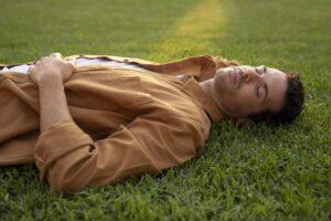laying down on the grass and relaxing is another way of seeing the benefits of meditation