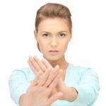 person indicating that one should not touch face if looking for home remedies for acne