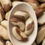 pic of spoonful of brazil nuts that contain selenium that is crucial for thyroid health
