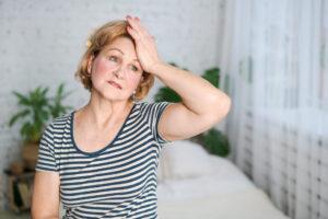 woman experiencing signs of menopause